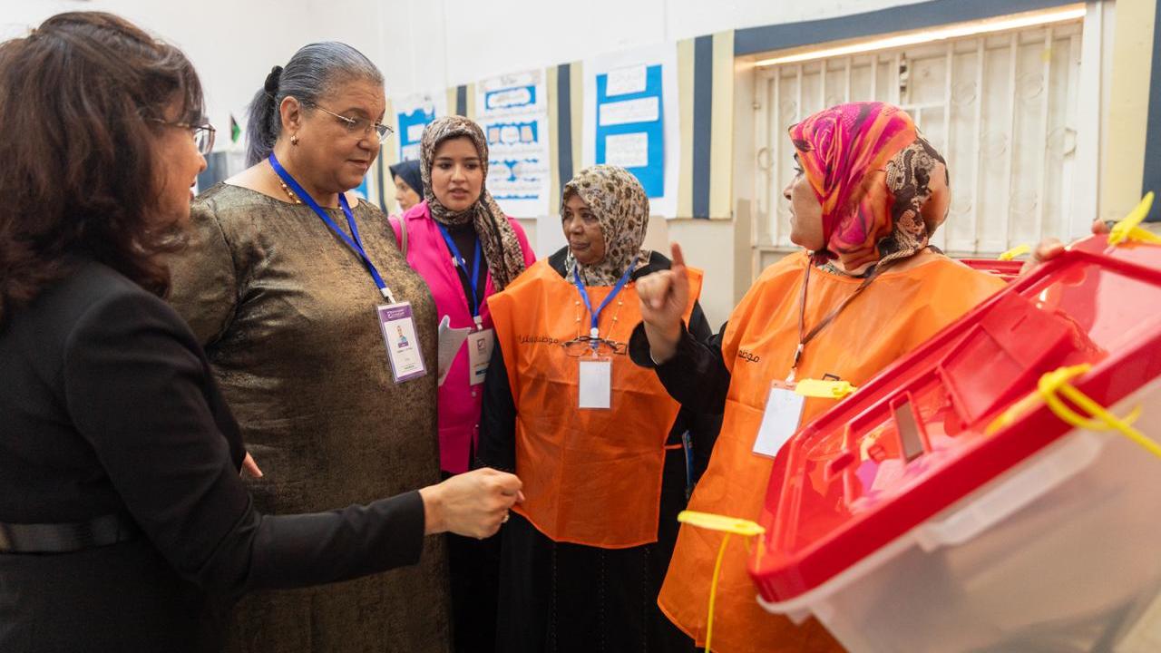 HNEC staff in demonstrating the municipal elections process to the SRSG Hanna Tetteh