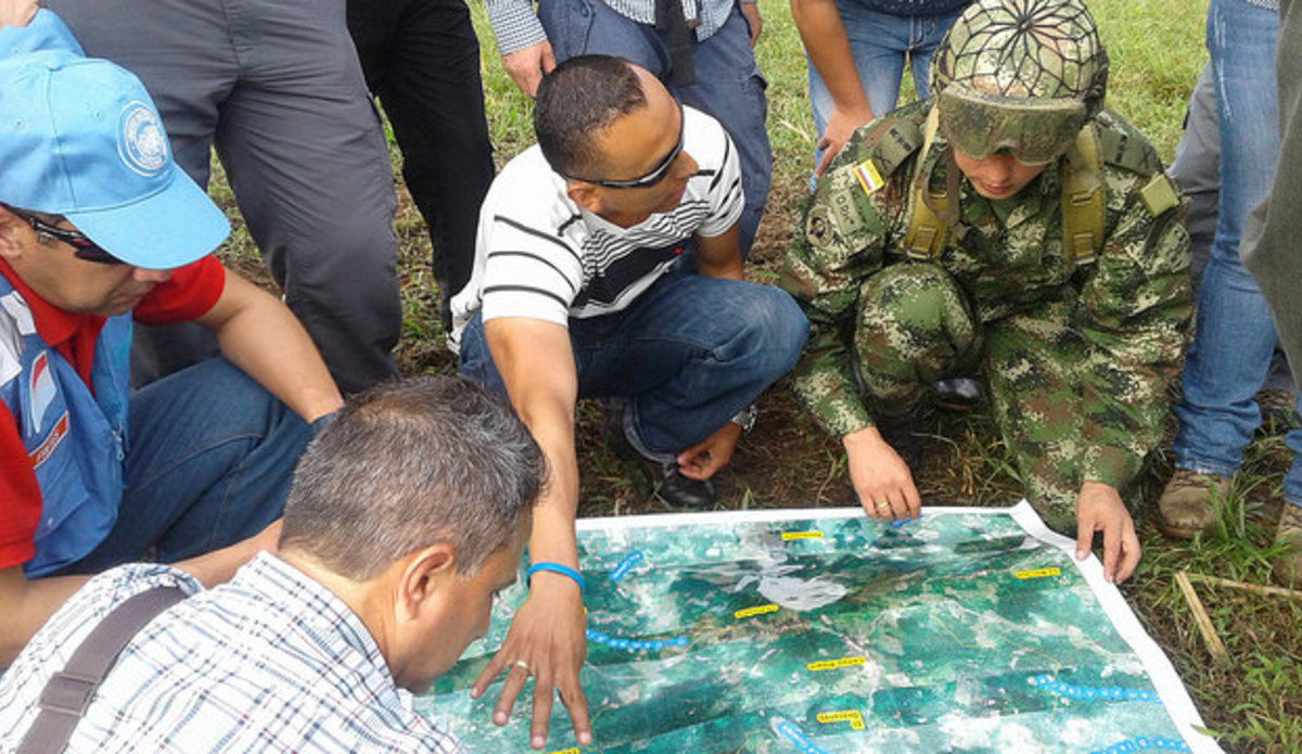UN staff and observers carry out planning work for the mission in the field